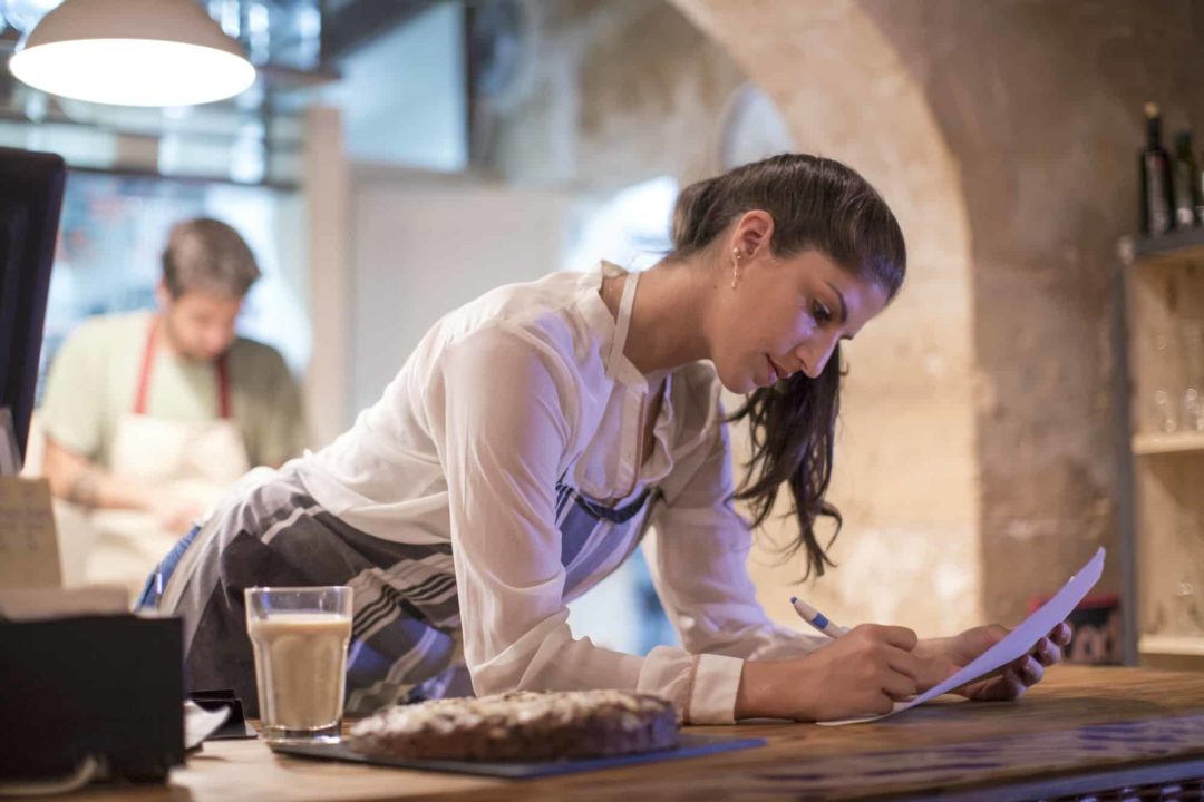 Restaurant owners working in kitchen